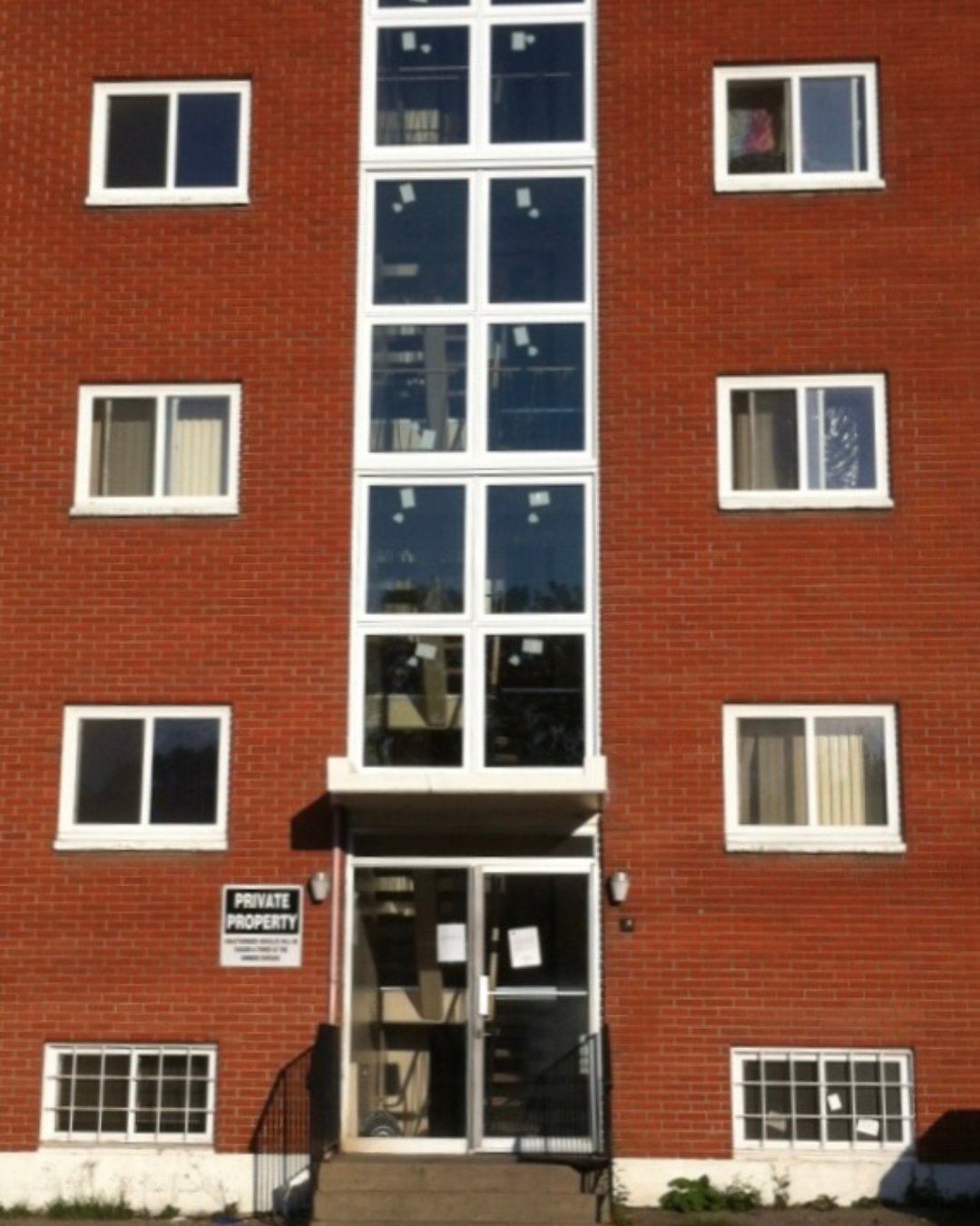 Horizontal vinyl sliding window with modern design, energy-efficient frame, Toronto Canada home exterior.