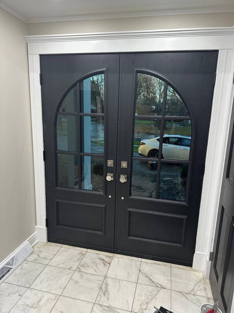 After Custom Matte-Black Fiberglass Double Doors With Arched Glass