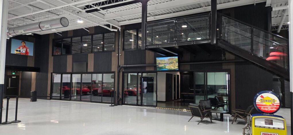 Multi-panel stacking sliding door system for open-concept commercial space.