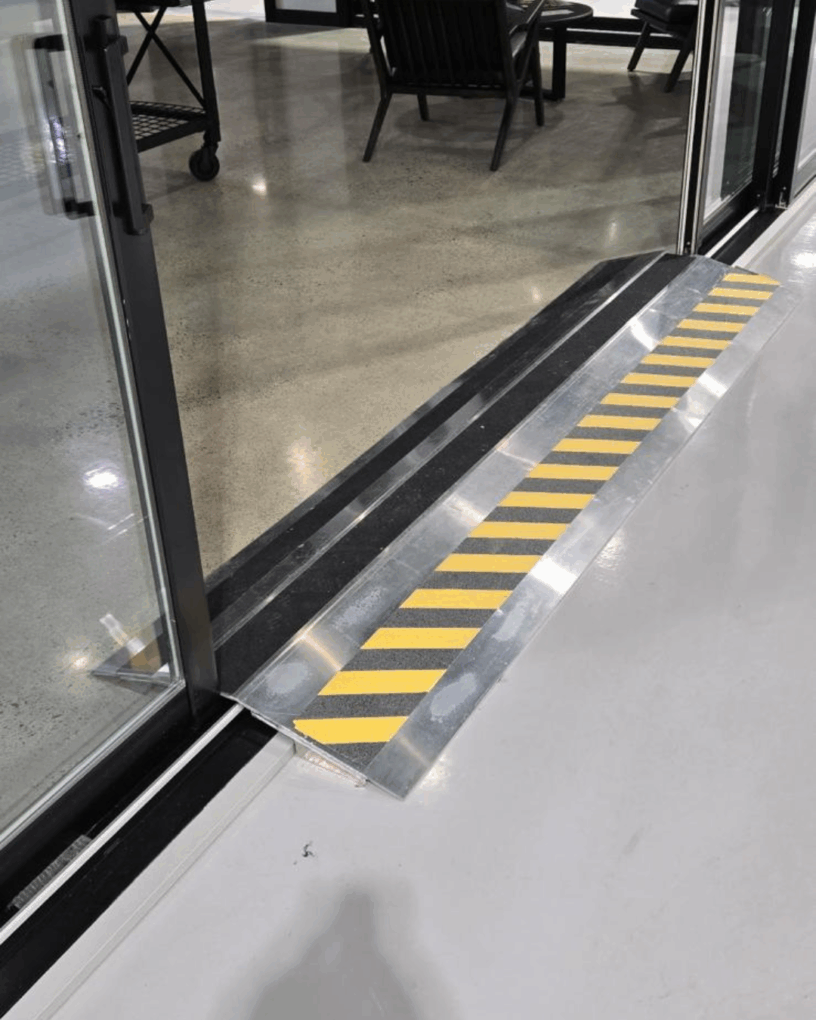 Custom aluminum accessibility threshold installed at York 363.