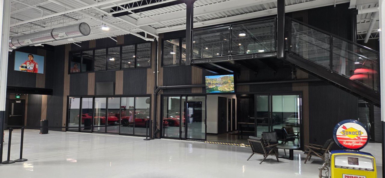 Multi-panel stacking sliding door system for open-concept commercial space.