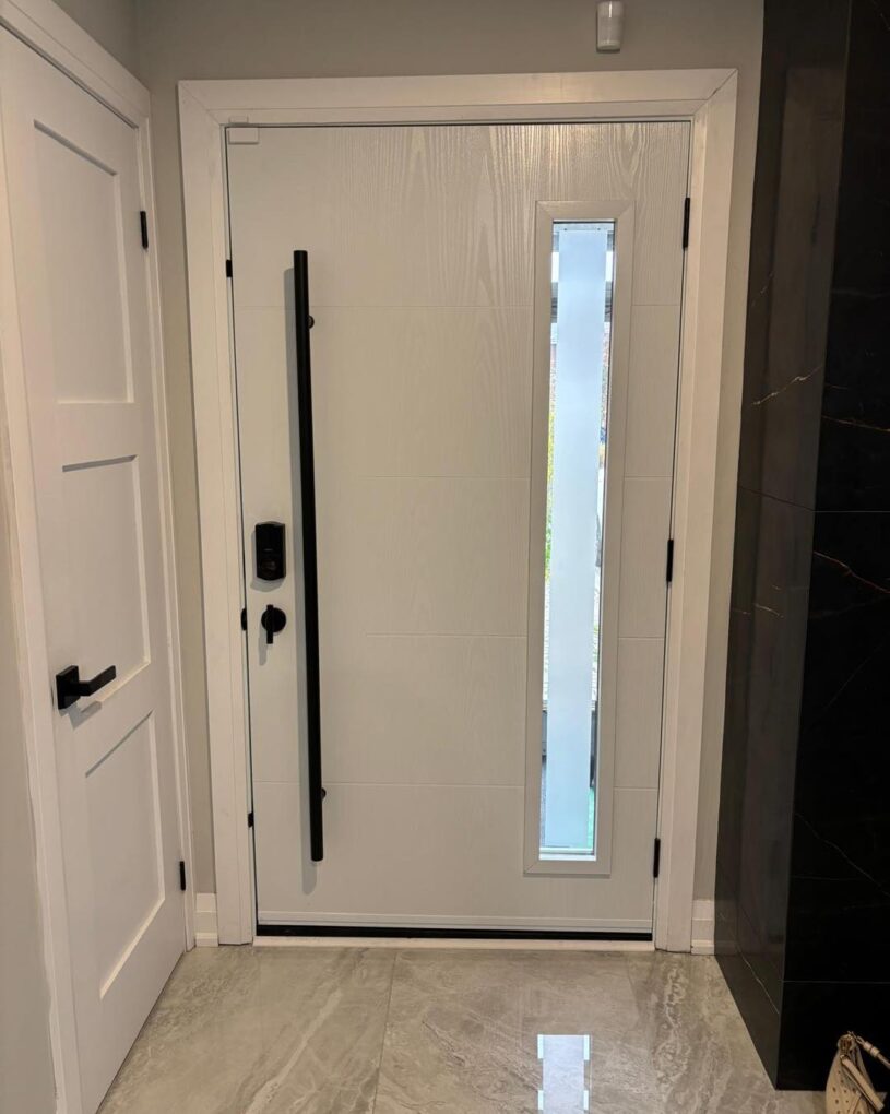 Custom blue fiberglass entry door with vertical glass insert. (1)