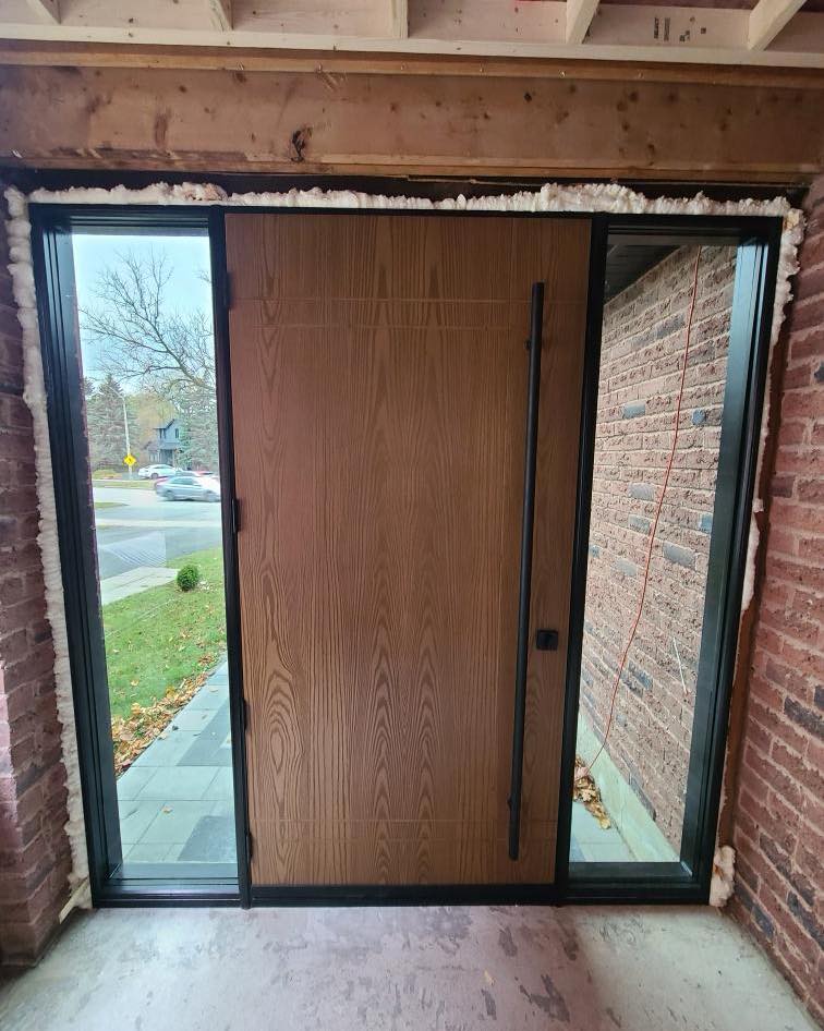 Interior view during installation showing the filtered light through privacy glass sidelites.