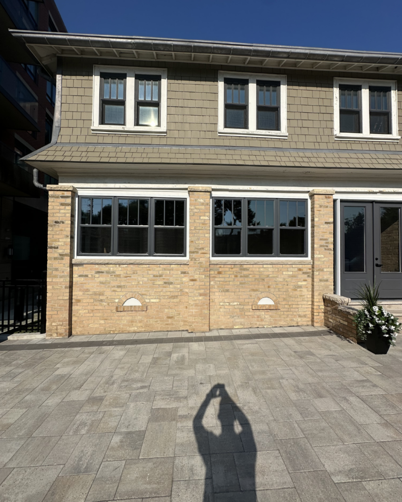 Traditional-style windows and double entry doors installed on a character home in Toronto.
