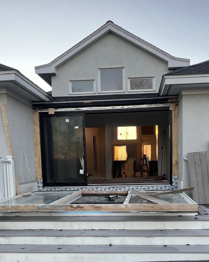 Rimini 3-panel sliding doors installed in Massachusetts with a wide opening and modern black frame.