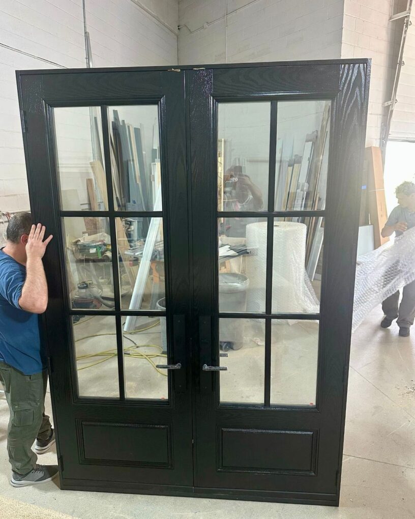 Black fiberglass double door with glass panels and grid design