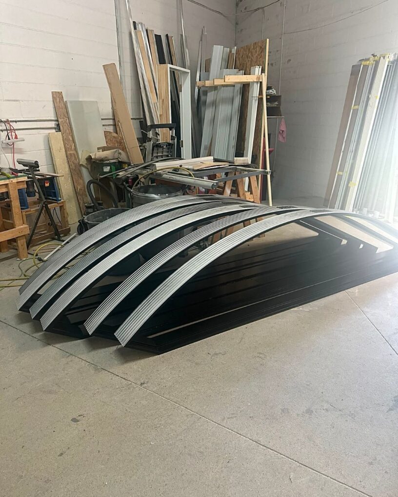 Custom curved window frames prepared for the Moonrise Valley project.