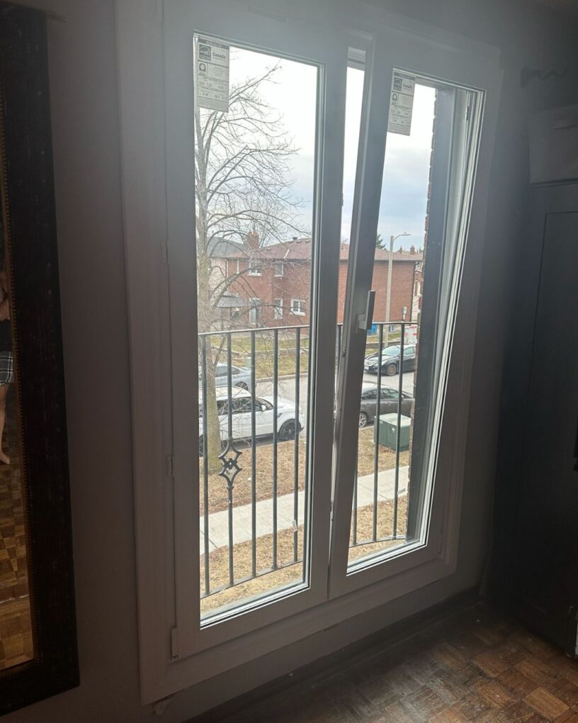 Large glass tilt and turn doors creating a bright patio opening in Maple
