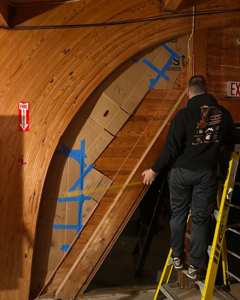 Measuring and preparing the curved side opening for custom glass.