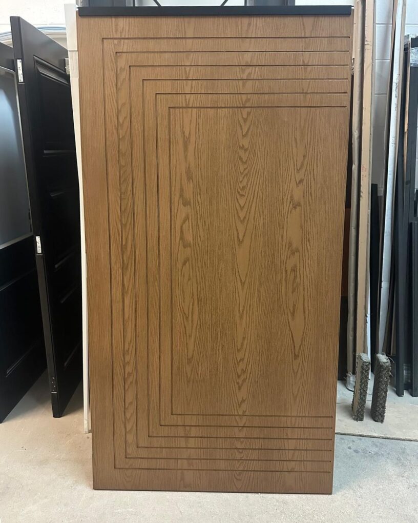 A wood grain fiberglass front door