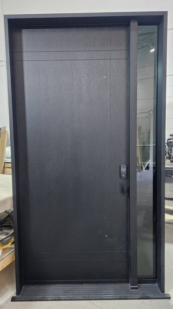 Black fiberglass front door with glass sidelight and electronic lock