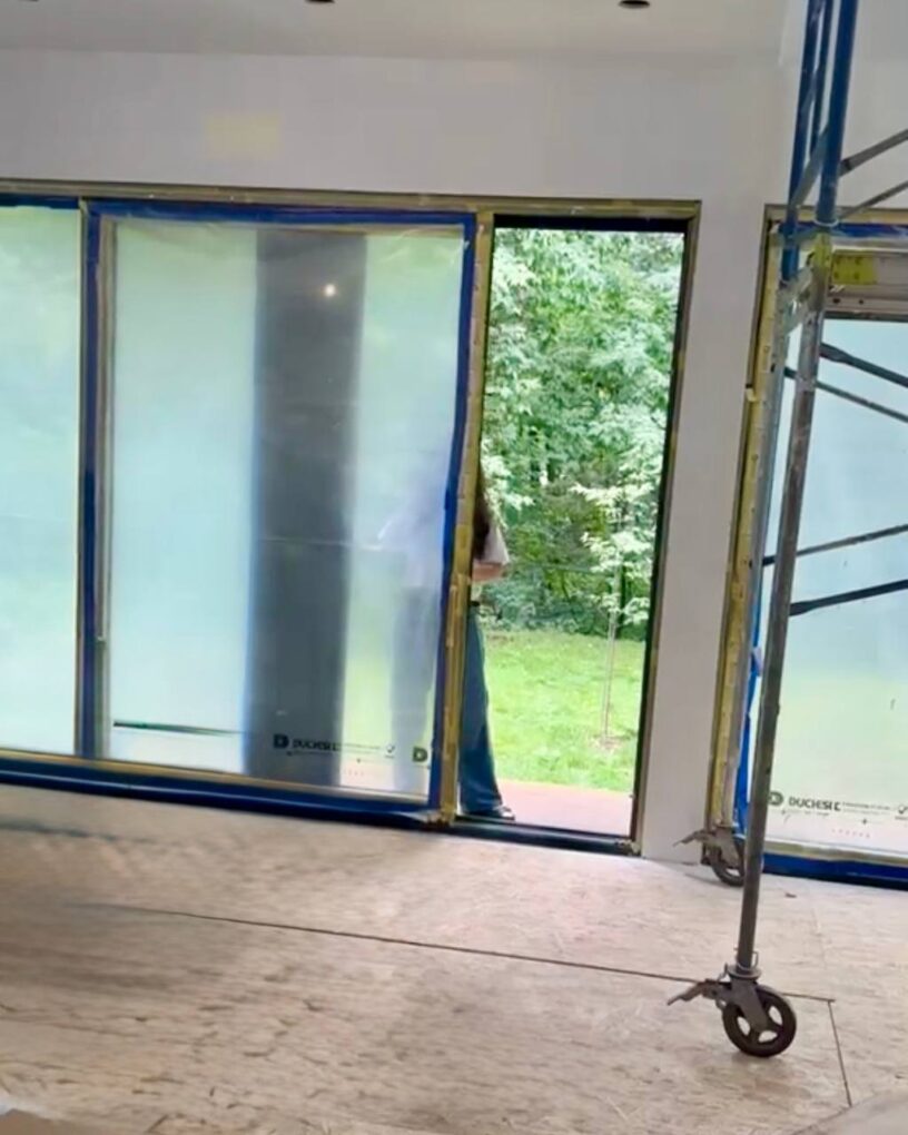 Large lift and slide patio doors overlooking a backyard in Toronto