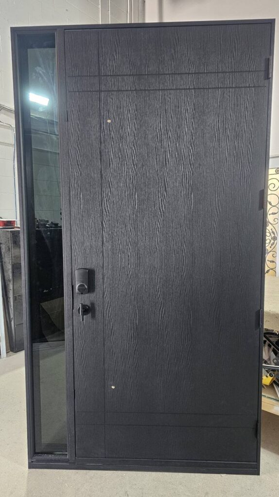 Woodgrain black fiberglass entry door with horizontal detailing and sidelight