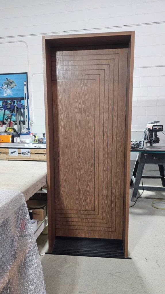 Fiberglass wood grain front door with geometric grooving and brown finish